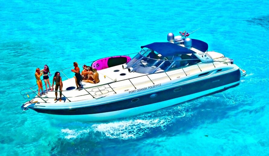 Luxury 60ft yacht rental Cancun Diva with group of people enjoying party on deck in turquoise water