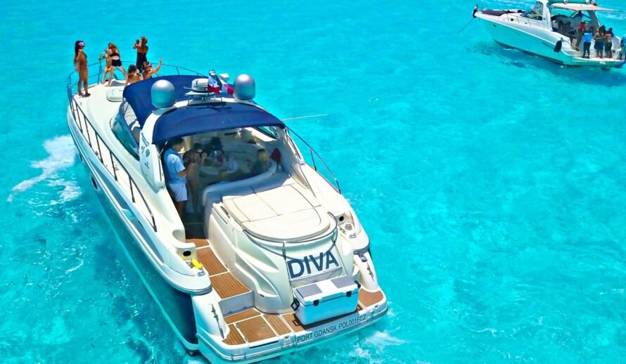 Luxury 60ft yacht Diva rental in Cancun with group of people enjoying cruise in turquoise Caribbean water