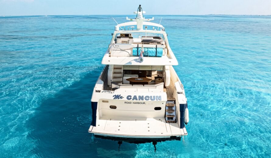 Ferretti 72 yacht rear view in Cancun turquoise Caribbean water