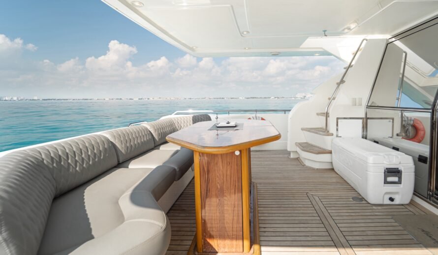 Ferretti 72 yacht lounge area in Cancun with comfortable seating and ocean view
